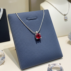 ciondolo punto  luce in oro bianco 18k e rubino naturale 0,50 ct